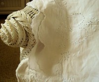 embroidered-pillowcase-wicker-rolled-arm-daybed.jpg