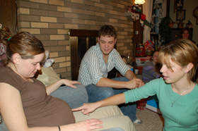 pointing-to-pregnant-mothers-belly-by-abardwell.jpg