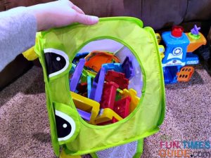 We keep the linking track pieces from VTech playsets in a collapsible laundry basket.