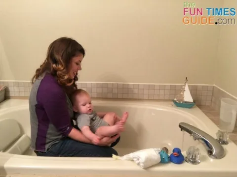 This is how I'm teaching my baby to go potty without a diaper -- in the bathtub or shower.