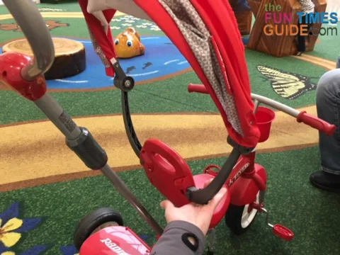 The Radio Flyer's canopy detaches in seconds by pushing the release buttons.