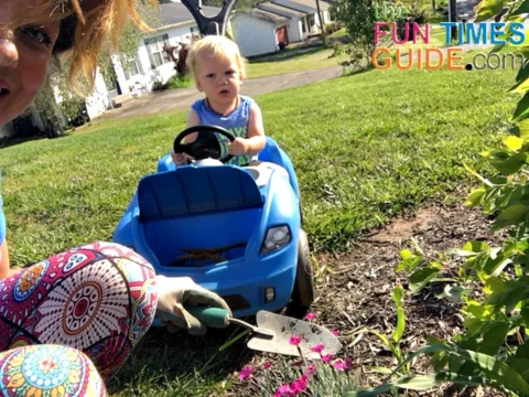This toddler ride on push car stroller is perfect for when I'm doing yardwork outside! 